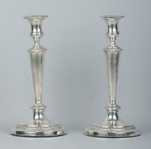 A large pair of George III candlesticks with detachable nozzles. Assayed Sheffield 1809 by John