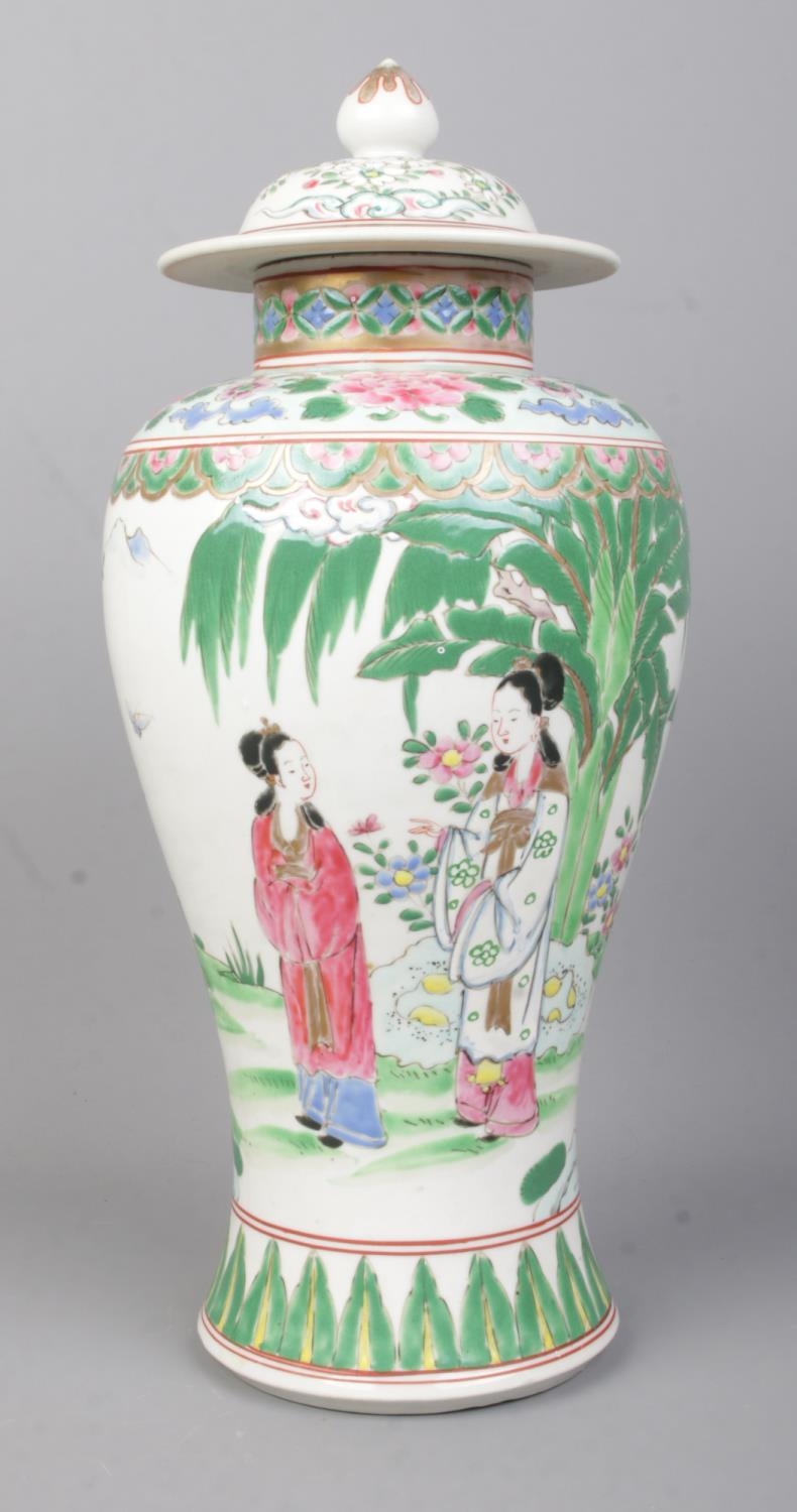 A Chinese Famille Vert lidded baluster vase with coloured enamels, depicting figures in - Image 2 of 3