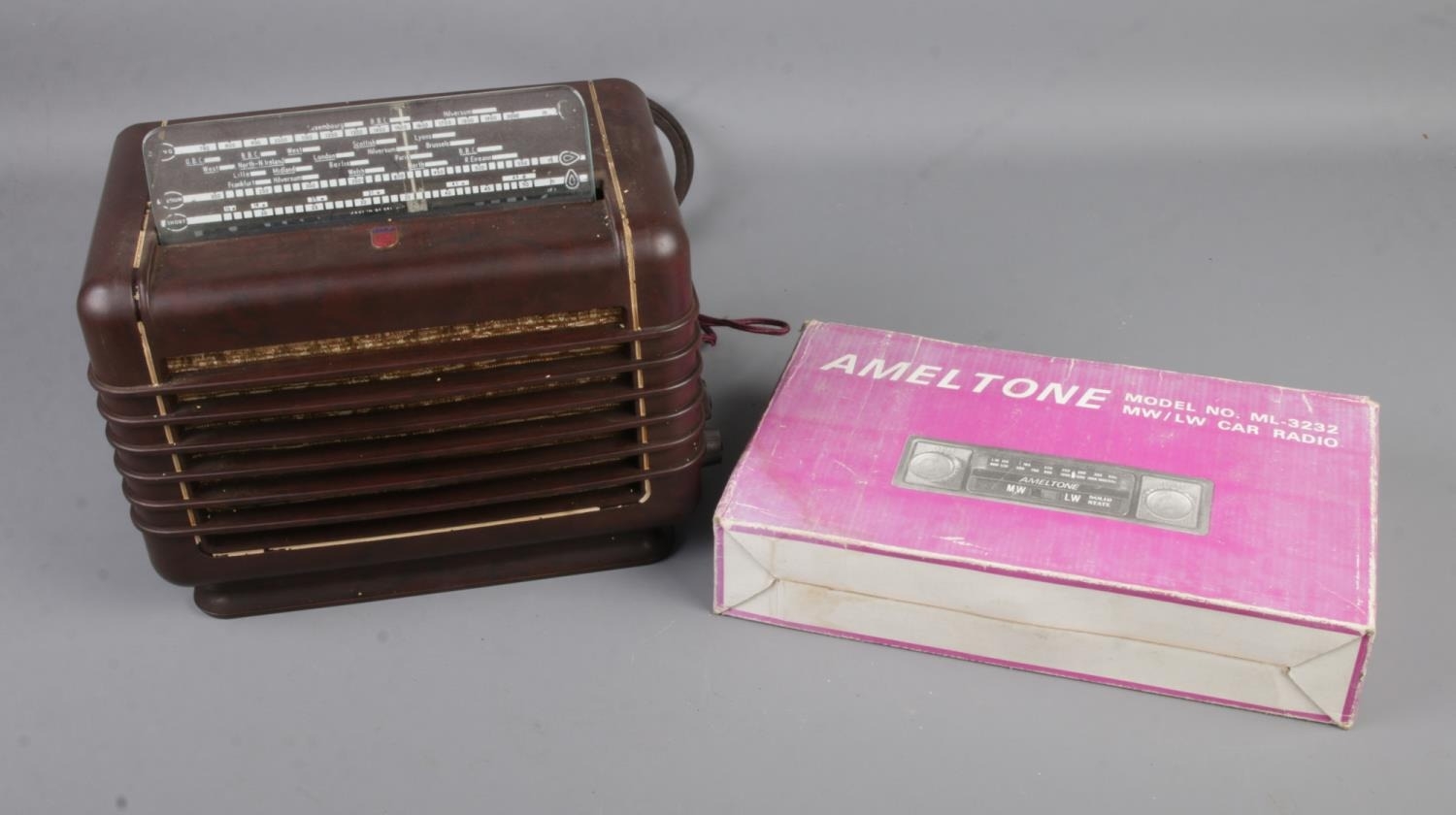 A Philips 290U-15 vintage bakelite cased radio along with a boxed Ameltone car radio.