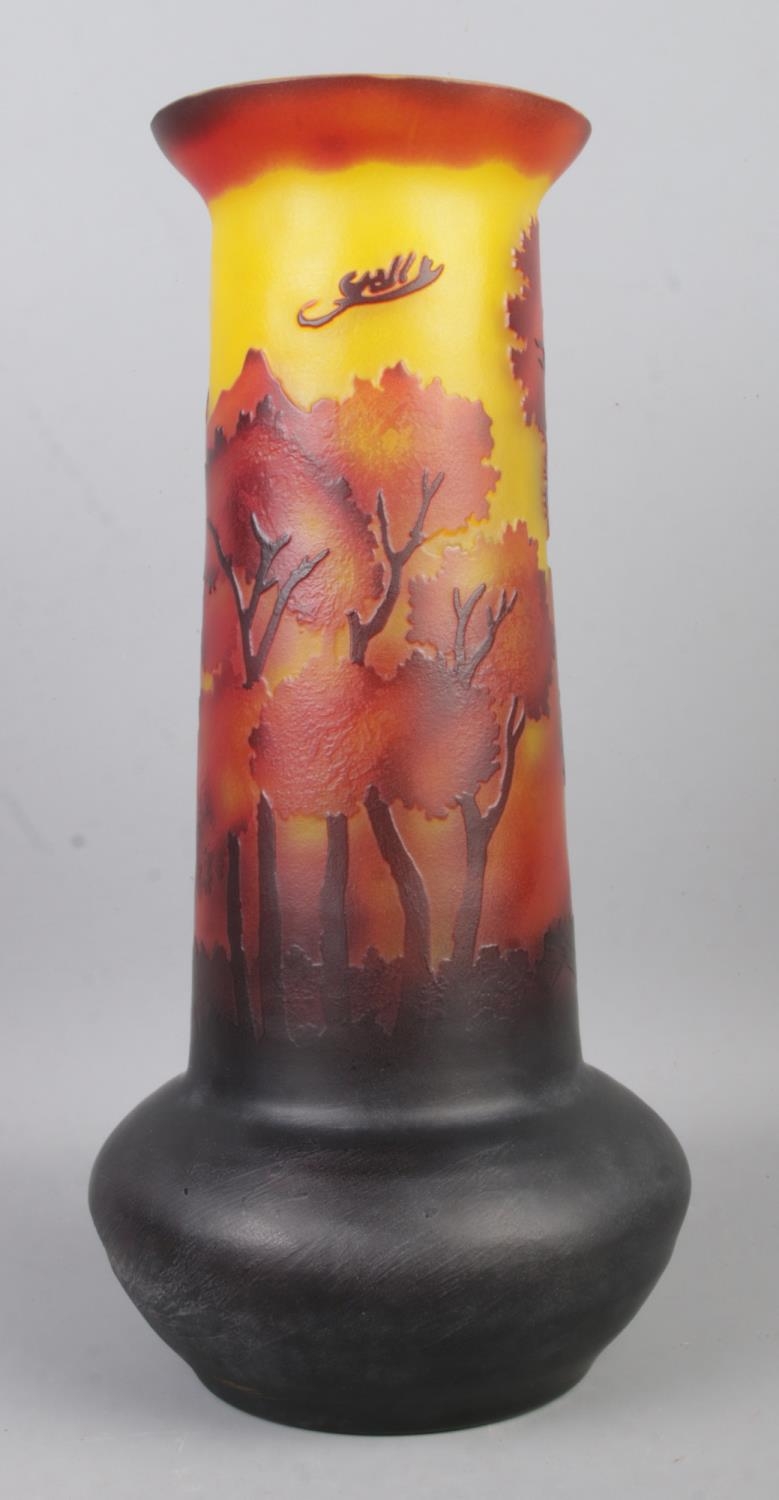 A Galle style glass vase of bulbous form, with tapered neck depicting a forest scene. Height: 31cm.