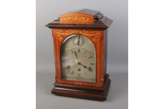 A Victorian mahogany inlaid bracket clock by Kienzle Uhren, featuring an architectural case and an - Image 1 of 3