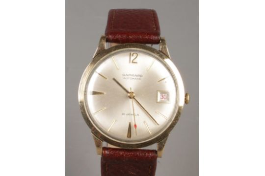 A gents 9ct gold Garrard automatic wristwatch. With centre seconds, baton markers and date