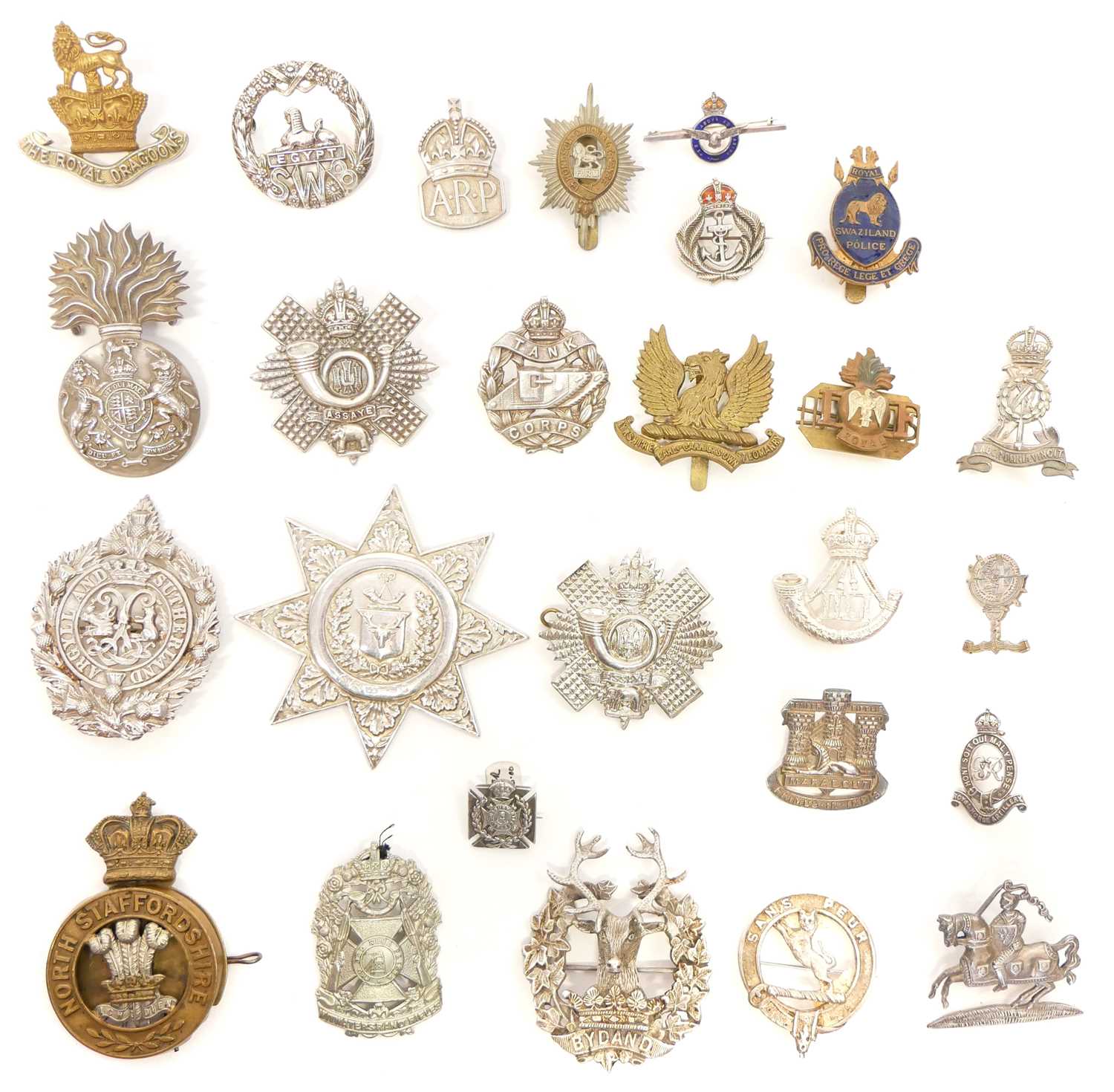 Twenty six British Army cap badges and Scottish clan badges, ten of which are Sterling silver.