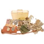 Collection of military items, including a kit rucksack, gun slip, leather and webbing belts, two