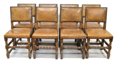 Eight early 20th century leather upholstered dining chairs
