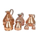 Seven Graduated Copper Measuring Jugs