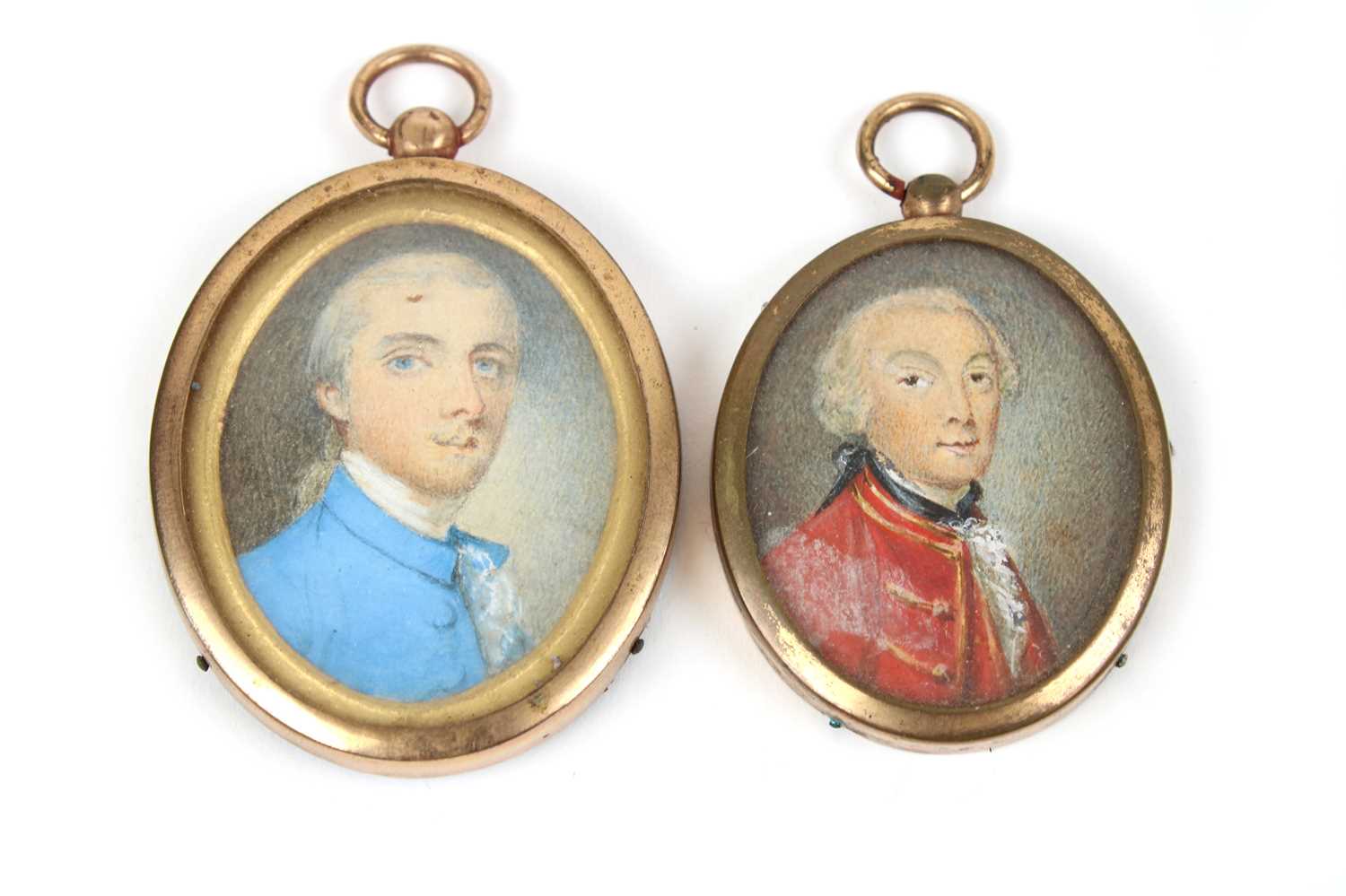 English School (19th century) Portraits of two gentlemen, bust length, in blue and red coats