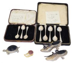 A selection of silver flatware and plated novelty pin cushions,