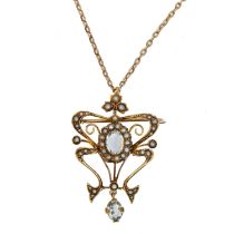 An early 20th century blue topaz and split pearl pendant,