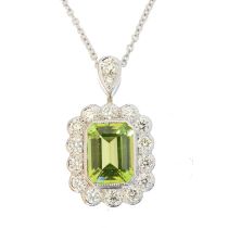 A peridot and diamond pendant,
