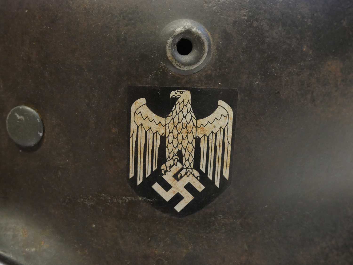 German WWII M40 helmet, stamped Q64 DN44, the originality of the decals is not known, the helmet - Image 5 of 9