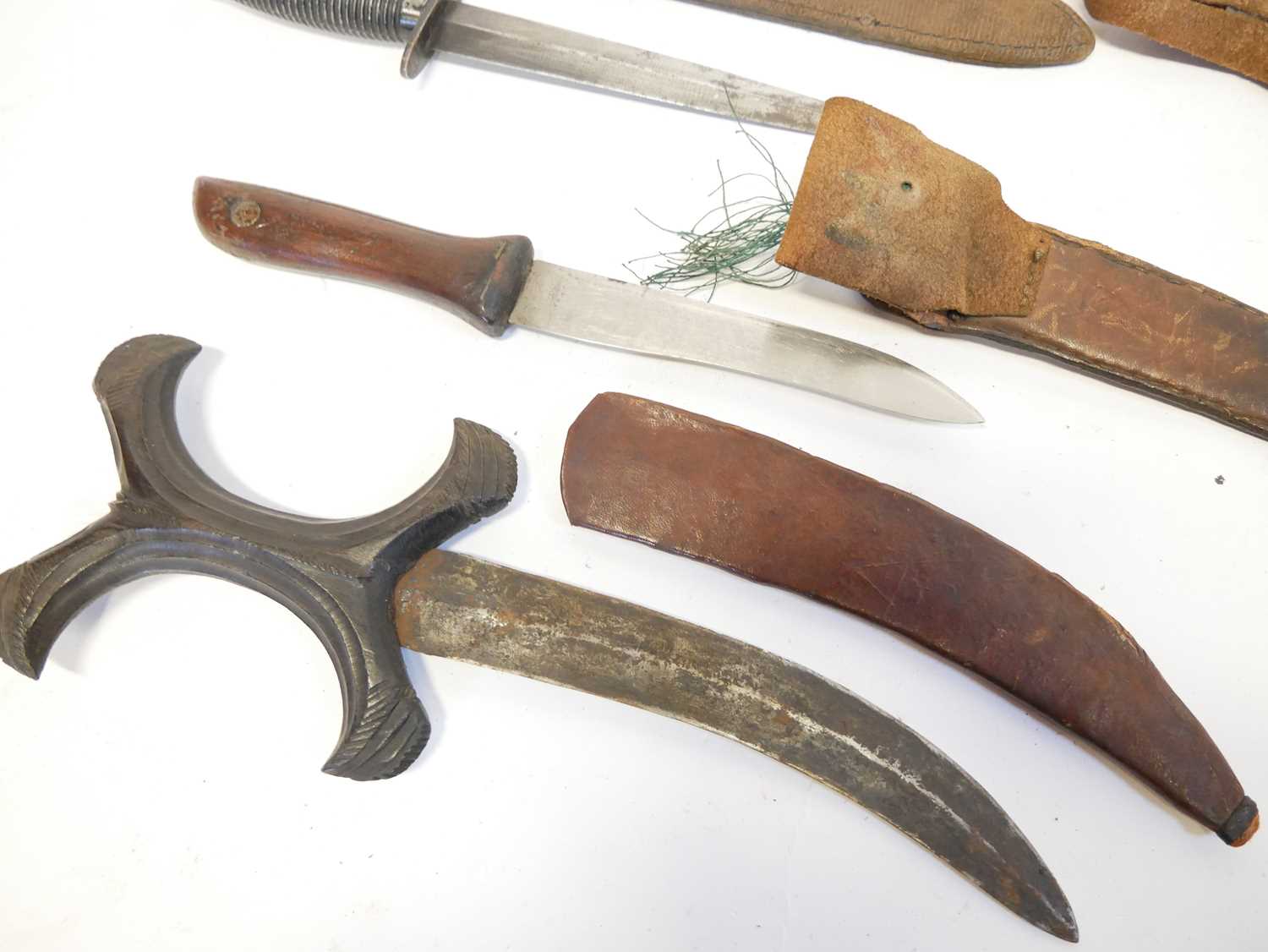 Collection of knives, to include a Fairbairn Sykes dagger, a Hadendoa warrior's dagger, curved - Image 11 of 14