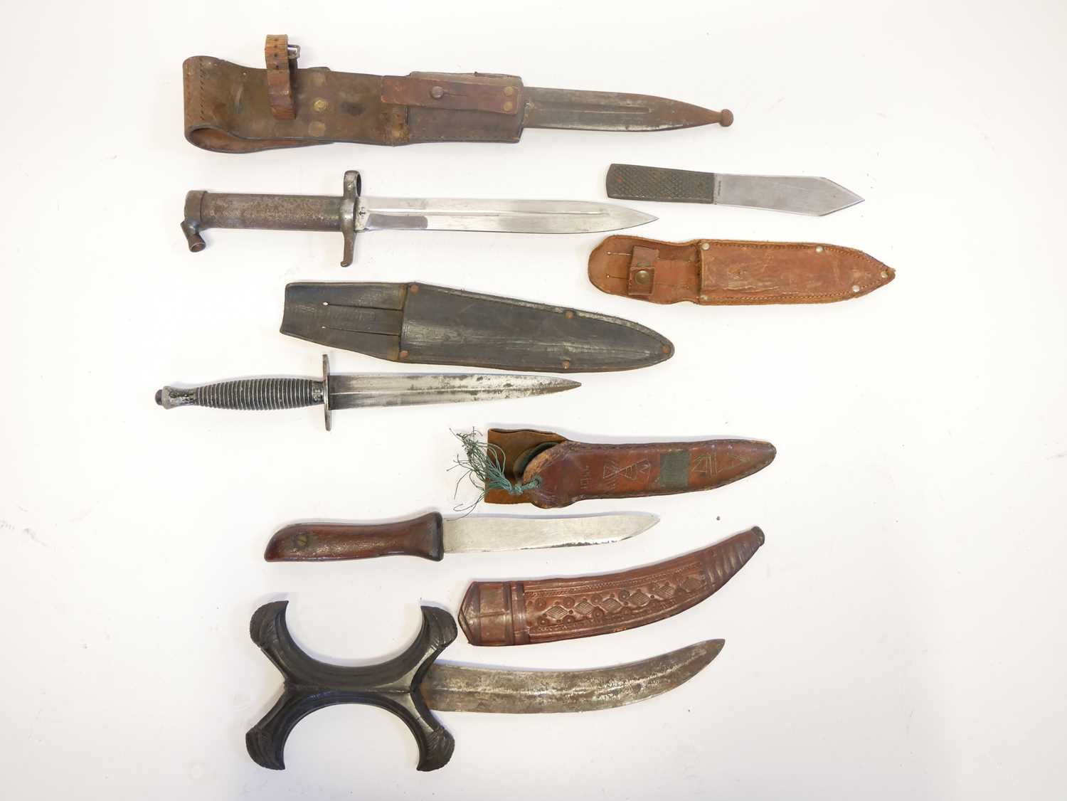Collection of knives, to include a Fairbairn Sykes dagger, a Hadendoa warrior's dagger, curved - Image 2 of 14