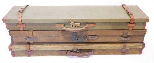 Three canvas and leather shotgun cases, each will fit barrels up to 30 inches in length.