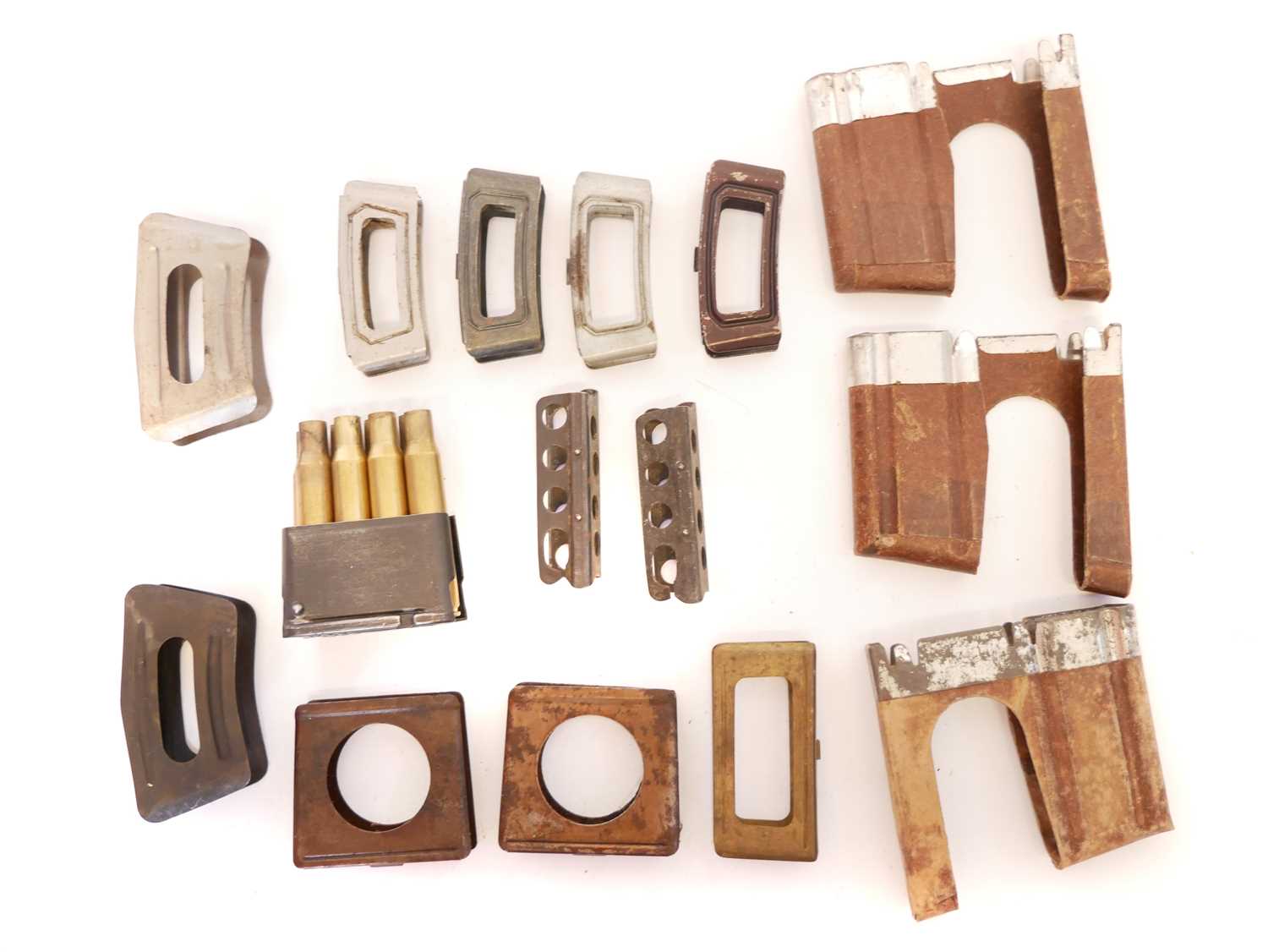 Collection of rifle clips, to include two five round Berthier clips, four Dutch Mannlicher 1895