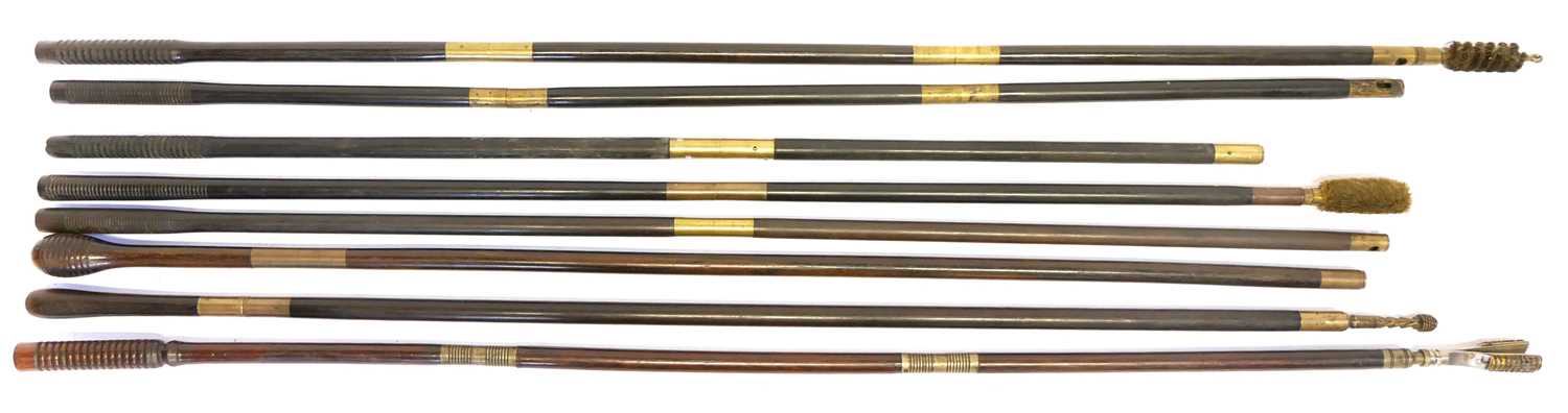 Eight good quality ebony and rosewood cleaning rods, some fitted with jags, mops and brushes.