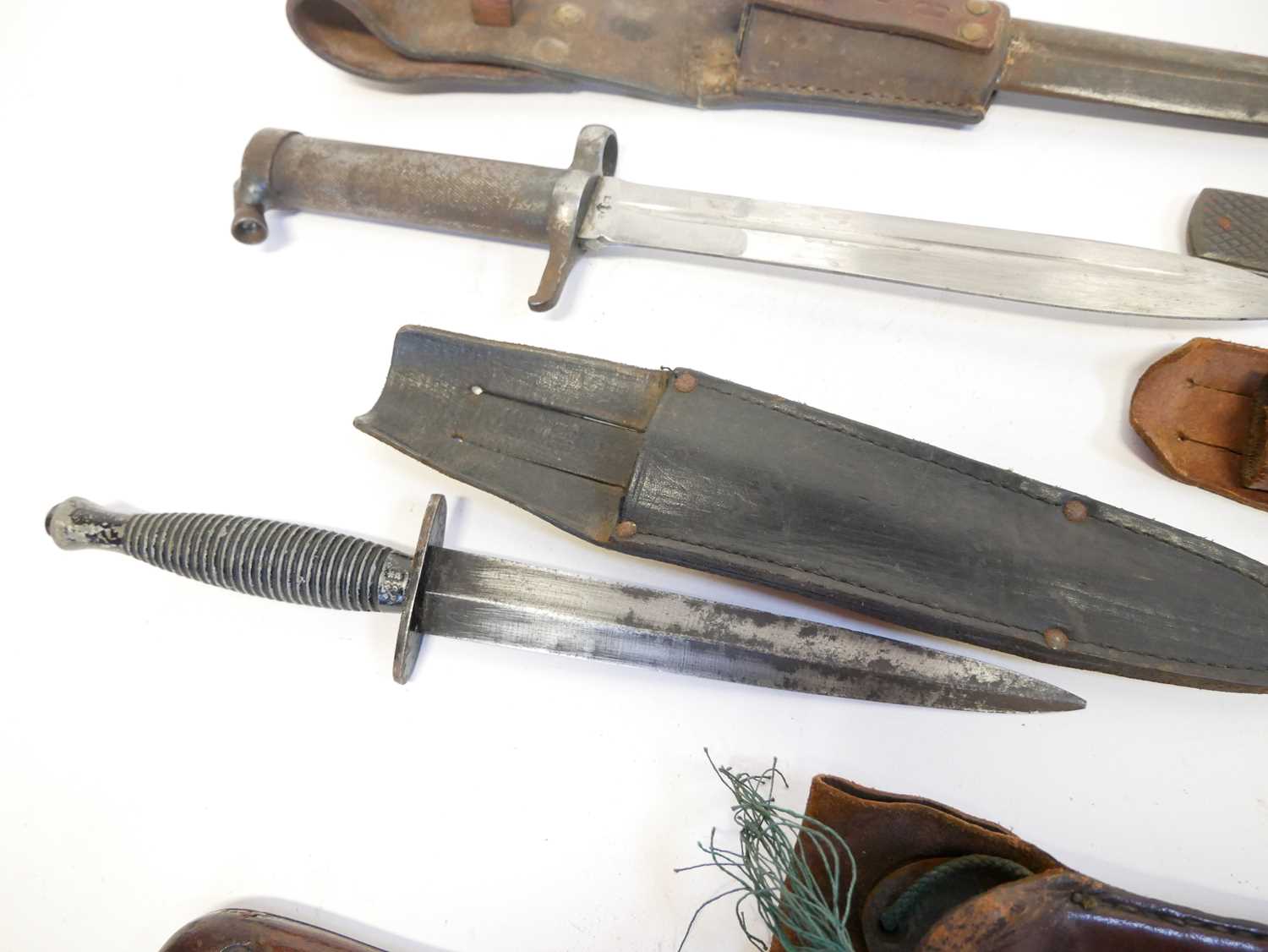 Collection of knives, to include a Fairbairn Sykes dagger, a Hadendoa warrior's dagger, curved - Image 6 of 14