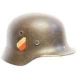 German WWII M40 helmet, stamped Q64 DN44, the originality of the decals is not known, the helmet