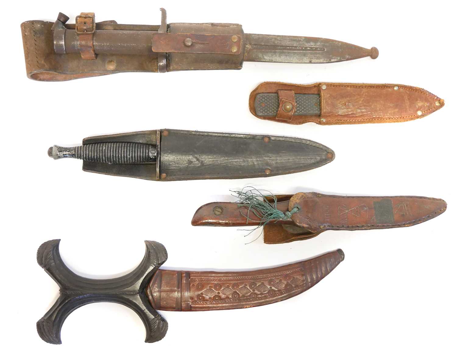 Collection of knives, to include a Fairbairn Sykes dagger, a Hadendoa warrior's dagger, curved