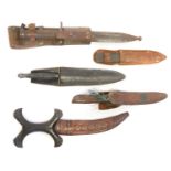 Collection of knives, to include a Fairbairn Sykes dagger, a Hadendoa warrior's dagger, curved