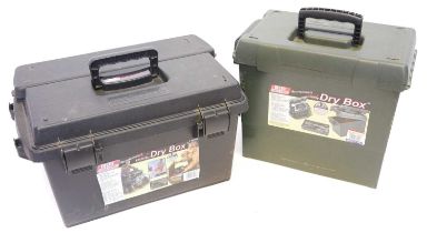 Two MTM range boxes full of black powder shooting equipment, including patches, wads, wad punches,
