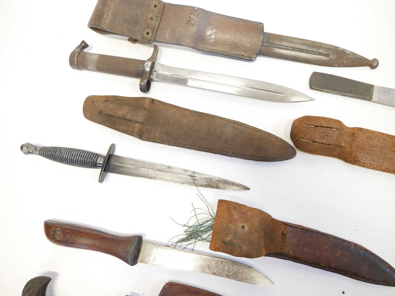 Collection of knives, to include a Fairbairn Sykes dagger, a Hadendoa warrior's dagger, curved - Image 12 of 14