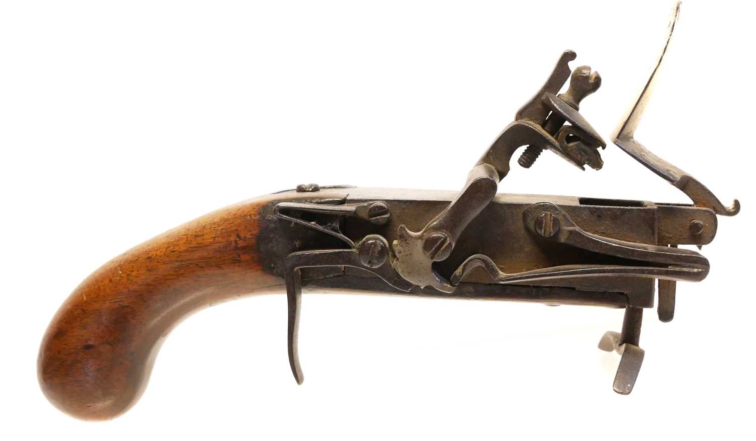 Flintlock tinder box lighter, with exposed action and wood pistol grip stock. 21cm long The