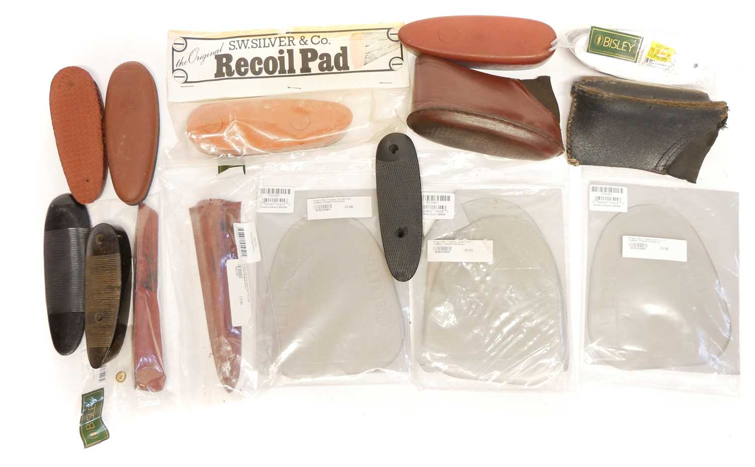 Collection of recoil pads and butt caps also three Beretta cheek pads, mostly unused.