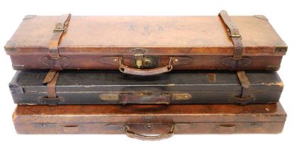 Three leather shotgun cases, one labelled Samuel Ebrall of Shrewsbury to fit 28inch barrels, another