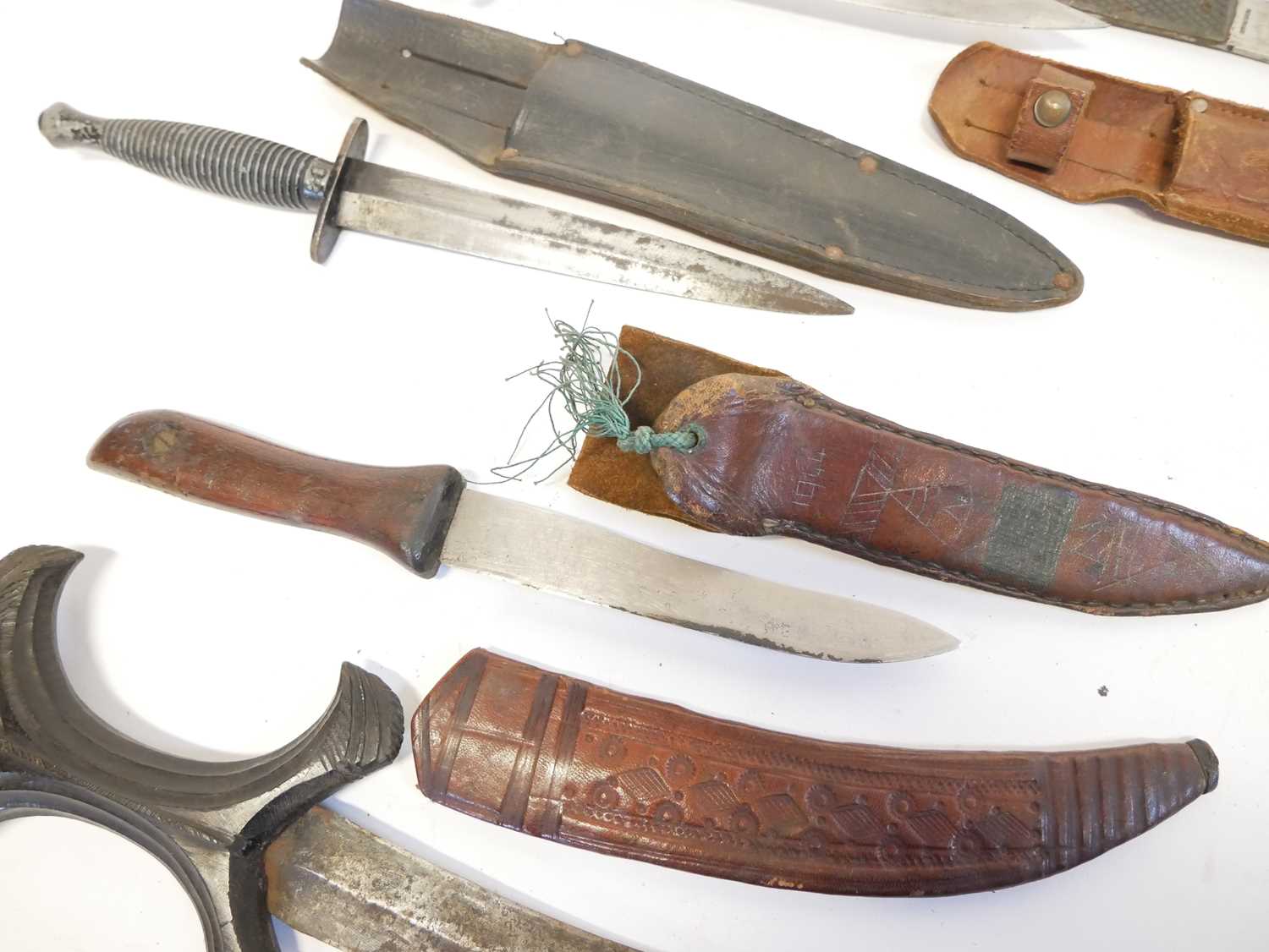 Collection of knives, to include a Fairbairn Sykes dagger, a Hadendoa warrior's dagger, curved - Image 5 of 14