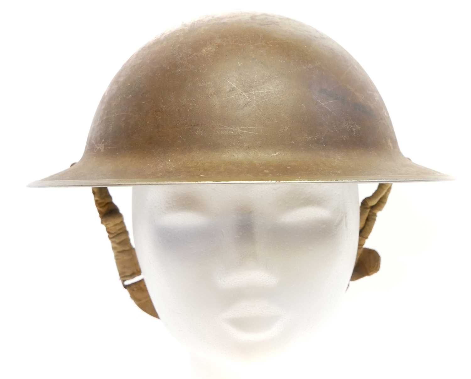 British WWII MkII Brodie or 'Tommy' helmet, dated 1942 and stamped C.L/C 44. 31cm long