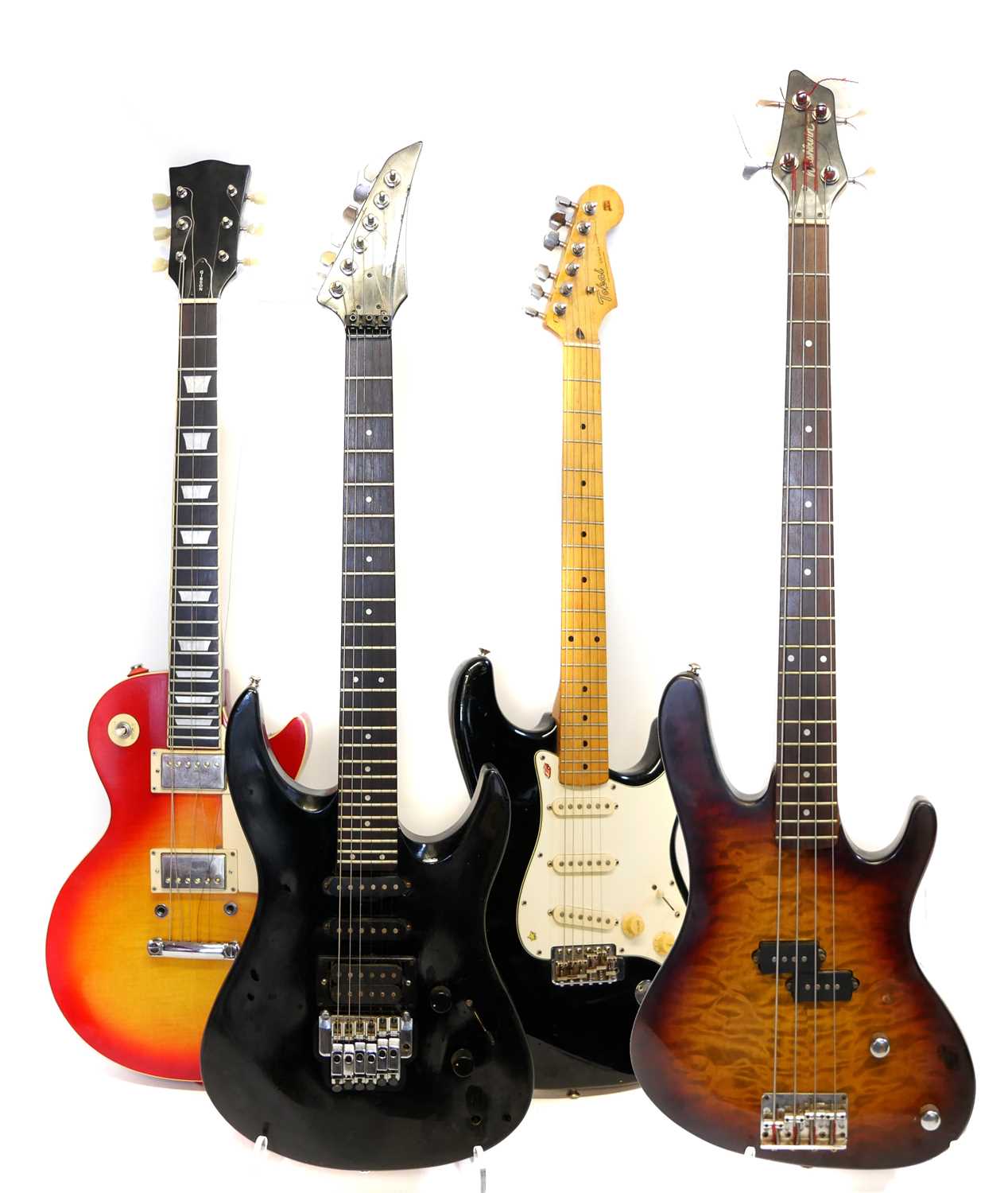 Three Electric Guitars and a Bass Guitar