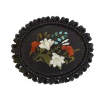 A large Victorian pietra dura brooch.