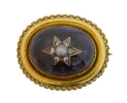 A Victorian garnet, split pearl and diamond brooch.