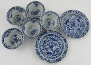 Five Chinese porcelain tea bowls, and two saucers, decorated with crabs and fishes in blue and