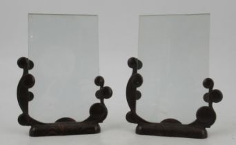 A pair of Bakerlite and glass photograph holders