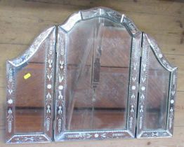 A three fold dressing table mirror, with etched decorated to the mirrored frame