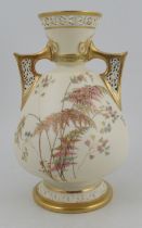 A Royal Worcester gilded ivory vase, with pierced handles and neck, decorated with ferns shape No