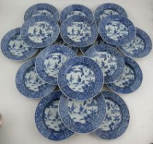 Eleven Chinese porcelain soup dishes and eight plates, decorated with figures to a floral boarder,