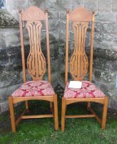 A pair of tall oak special dining chairs, by Timothy Hawkins, Fine Furniture of Ledbury, with a