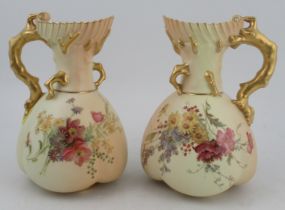 A pair of Royal Worcester quarter lobbed blush ivory coral jugs, decorated with flowers, shape No