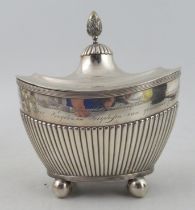 A 19th century Dutch silver oval covered sugar box, with inscription over gadrooned lower body,