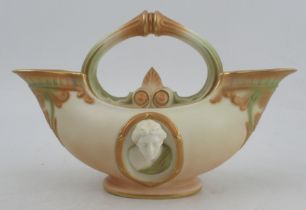 A Royal Worcester double ended flower basket, with oval relief mask panels and in the classical