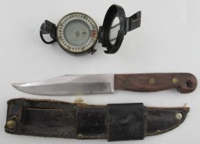 A T.G.Co Ltd London military issue compass, numbered 1943 MKIII, together with a knife, in leather