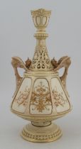 A Royal Worcester Persian style gilded ivory vase, with pierced neck and fledgling bird handles,