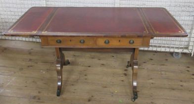 A 19th century walnut cross banded sofa table, with tooled leather inlaid top, with dummy and real