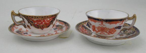 Two miniature Royal Crown Derby tea cup and saucers, decorated in the Imari pattern