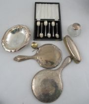 A collection of silver, to include two dressing table mirrors, a brush, a cased set of six coffee