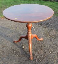 A Georgian mahogany circular occasional table, with bird cage action, turned column to three