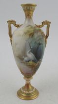 A Royal Worcester pedestal vase, decorated all round with a landscape and stork by Lewis, shape